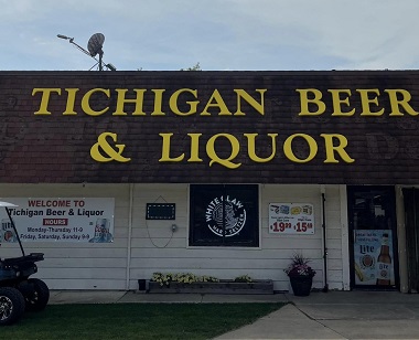 Beer and liquor store with large yellow letters on room that say Tichigan Beer and liquor Store. This is a beer and liquor store in Waterford, WI, part of Ron's Super Service